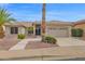 Charming single-story home with desert landscaping, palm trees, and a two-car garage in a desirable community at 17443 N Goldwater Dr, Surprise, AZ 85374