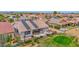 Backyard view with patio, desert landscaping, and a home with solar panels on its roof at 17443 N Goldwater Dr, Surprise, AZ 85374