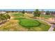 Scenic golf course view, showcasing the lush green with mature trees and a winding cart path at 17443 N Goldwater Dr, Surprise, AZ 85374