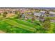 Lush green golf course featuring mature trees, perfectly manicured greens, and cart paths at 17443 N Goldwater Dr, Surprise, AZ 85374