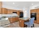 Bright kitchen with granite countertops, oak cabinets, stainless steel appliances and a center island at 17443 N Goldwater Dr, Surprise, AZ 85374