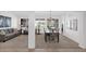 Bright living room with comfortable sofas, a dining table and many windows for plenty of natural light at 17443 N Goldwater Dr, Surprise, AZ 85374