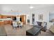 Open floor plan shows a kitchen with granite counters leading into living room with tile floors at 17443 N Goldwater Dr, Surprise, AZ 85374