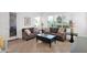 Bright living room with neutral tile, comfortable sofas, and views of the golf course at 17443 N Goldwater Dr, Surprise, AZ 85374