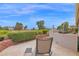 Outdoor patio features a built-in grill, stone flooring and views of the golf course at 17443 N Goldwater Dr, Surprise, AZ 85374