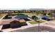 Aerial view of the community park's covered picnic area with basketball court and green space at 19072 N Ventana Ln, Maricopa, AZ 85138