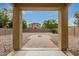 Backyard features gravel landscaping and a paver path with an outdoor fire pit at 19072 N Ventana Ln, Maricopa, AZ 85138