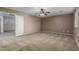 Spacious carpeted bedroom featuring neutral walls, and large open doorway at 19072 N Ventana Ln, Maricopa, AZ 85138