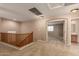 Spacious loft with natural lighting and a view of downstairs, offering a versatile living space at 19072 N Ventana Ln, Maricopa, AZ 85138