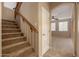 Carpeted staircase leading to a bright living area, creating a welcoming transition between floors at 19072 N Ventana Ln, Maricopa, AZ 85138