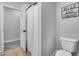 Cozy bathroom featuring a shower with stylish curtain and decorative wall art at 19443 W Valle Vista Way, Litchfield Park, AZ 85340