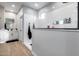 Modern bathroom with a large glass shower, sleek fixtures, and a glimpse of vanity area at 19443 W Valle Vista Way, Litchfield Park, AZ 85340
