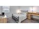 Bedroom featuring modern lighting, neutral walls, and a view from the bright and airy window at 19443 W Valle Vista Way, Litchfield Park, AZ 85340
