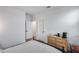 Bedroom featuring modern decor, neutral walls, and wood trim at 19443 W Valle Vista Way, Litchfield Park, AZ 85340