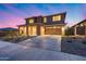 Beautiful two-story home with a two-car garage, charming stone accents, and low maintenance desert landscaping at 19443 W Valle Vista Way, Litchfield Park, AZ 85340