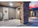 Beautifully decorated porch features stone columns and decorative welcome sign near front door at 19443 W Valle Vista Way, Litchfield Park, AZ 85340