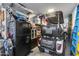 Organized garage space with epoxy floors, fridge, shelves and a golf cart at 19443 W Valle Vista Way, Litchfield Park, AZ 85340
