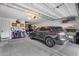 Spacious garage with epoxy floors, and a car at 19443 W Valle Vista Way, Litchfield Park, AZ 85340