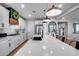 Open kitchen with a large island, modern appliances, and ample counter space for cooking at 19443 W Valle Vista Way, Litchfield Park, AZ 85340