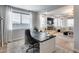 Open floor plan showcasing a bright office with a view into the comfortable and inviting living room at 19443 W Valle Vista Way, Litchfield Park, AZ 85340