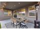 Inviting outdoor patio with dining table and seating, plus cozy heater for year-round enjoyment at 19443 W Valle Vista Way, Litchfield Park, AZ 85340