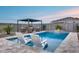 Inviting pool with lounge chairs, poolside pergola, and patio area at 19443 W Valle Vista Way, Litchfield Park, AZ 85340