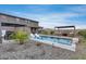 A large in-ground pool offers resort style living and entertaining in this nicely landscaped backyard at 19443 W Valle Vista Way, Litchfield Park, AZ 85340
