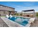 Beautiful in-ground pool and patio with outdoor seating and lounge chairs provide resort style living at 19443 W Valle Vista Way, Litchfield Park, AZ 85340