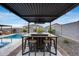 Entertain in style with this poolside bar featuring seating and a built-in fire pit at 19443 W Valle Vista Way, Litchfield Park, AZ 85340