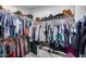 Spacious walk-in closet with ample storage and organized clothing racks and shelves at 19443 W Valle Vista Way, Litchfield Park, AZ 85340