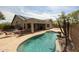 Beautiful backyard oasis featuring a pool, covered patio, and outdoor dining area, perfect for entertaining at 19622 N 66Th Ln, Glendale, AZ 85308