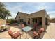 Spacious backyard patio with outdoor seating, perfect for relaxing and enjoying the serene surroundings at 19622 N 66Th Ln, Glendale, AZ 85308