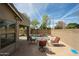 Backyard view with pool and outdoor dining area, ideal for enjoying outdoor living and entertaining at 19622 N 66Th Ln, Glendale, AZ 85308