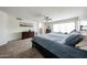 Large bedroom offering natural light, ceiling fan, archway and neutral tones at 19622 N 66Th Ln, Glendale, AZ 85308
