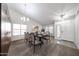 Bright dining room featuring a table set for six, and large built-in cabinets for ample storage space at 19622 N 66Th Ln, Glendale, AZ 85308