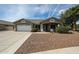 Charming single-story home featuring a two-car garage and desert landscaping for low maintenance at 19622 N 66Th Ln, Glendale, AZ 85308