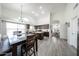 Bright kitchen with an island, white backsplash, and stainless steel appliances at 19622 N 66Th Ln, Glendale, AZ 85308