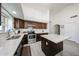 Well-lit kitchen featuring an island with white countertops and stainless steel appliances at 19622 N 66Th Ln, Glendale, AZ 85308