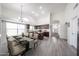 Open concept kitchen and dining room with a large island, stainless steel appliances, and modern finishes at 19622 N 66Th Ln, Glendale, AZ 85308