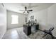 Bright home office with large window, modern desk, and stylish chair, ideal for productivity at 19622 N 66Th Ln, Glendale, AZ 85308