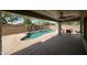 Back patio features a pebble tec pool, covered patio and desert landscaping at 19622 N 66Th Ln, Glendale, AZ 85308
