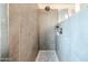 Close up of a shower with neutral colors, tile walls, and mosaic tile floor at 19622 N 66Th Ln, Glendale, AZ 85308