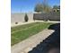 Private backyard featuring grass, stepping stones and decorative rock at 21816 E Puesta Del Sol --, Queen Creek, AZ 85142