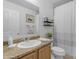 Bright bathroom features vanity, sink, mirror, and shower with curtain at 21816 E Puesta Del Sol --, Queen Creek, AZ 85142