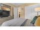 Comfortable bedroom featuring a dresser, closet and view to an ensuite bathroom at 21816 E Puesta Del Sol --, Queen Creek, AZ 85142