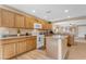 Bright kitchen features wood cabinets, granite countertops, stainless appliances, and a center island at 21816 E Puesta Del Sol --, Queen Creek, AZ 85142