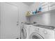 Laundry room with washer and dryer with shelves for storage at 21816 E Puesta Del Sol --, Queen Creek, AZ 85142
