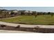 Manicured community greenspace with landscaping and walking paths for resident enjoyment at 25461 W Graham Trl, Buckeye, AZ 85326