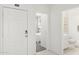Bright hallway showcasing bedroom and bathroom access, emphasizing the home's modern design at 25461 W Graham Trl, Buckeye, AZ 85326