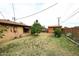 Spacious backyard featuring low-maintenance landscaping, a storage shed, and brick perimeter wall at 2619 W Lamar Rd, Phoenix, AZ 85017